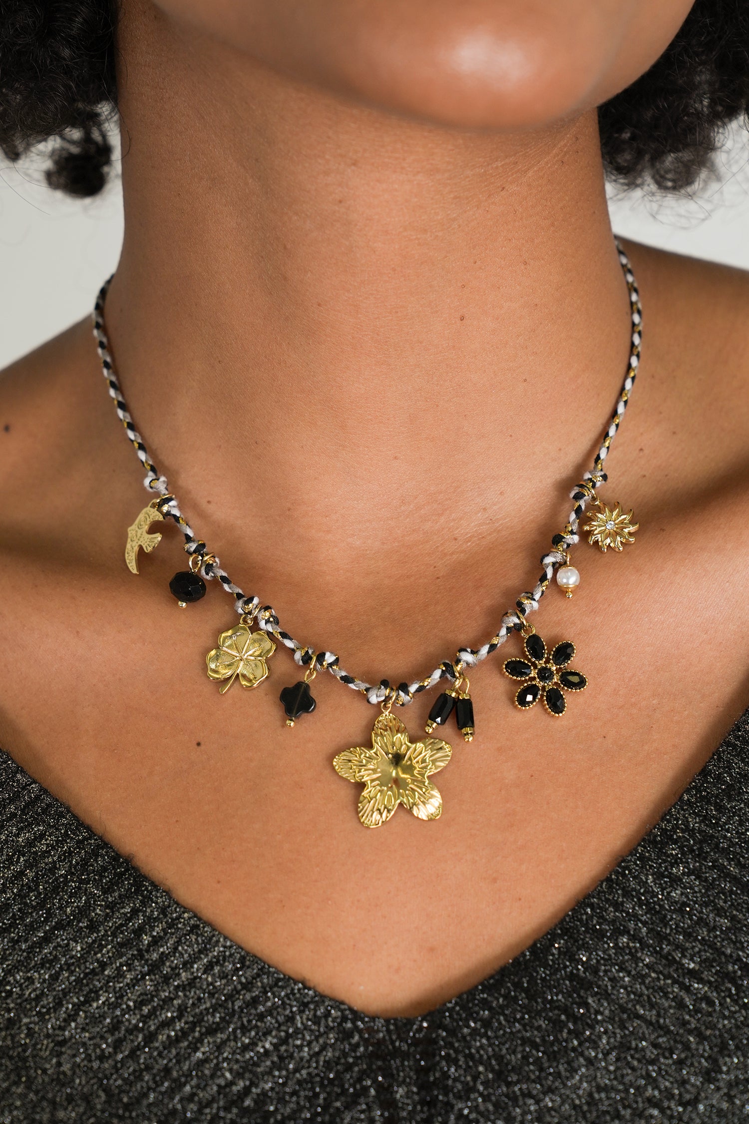 Black Flower Charm Necklace, a necklace from Something Pretty