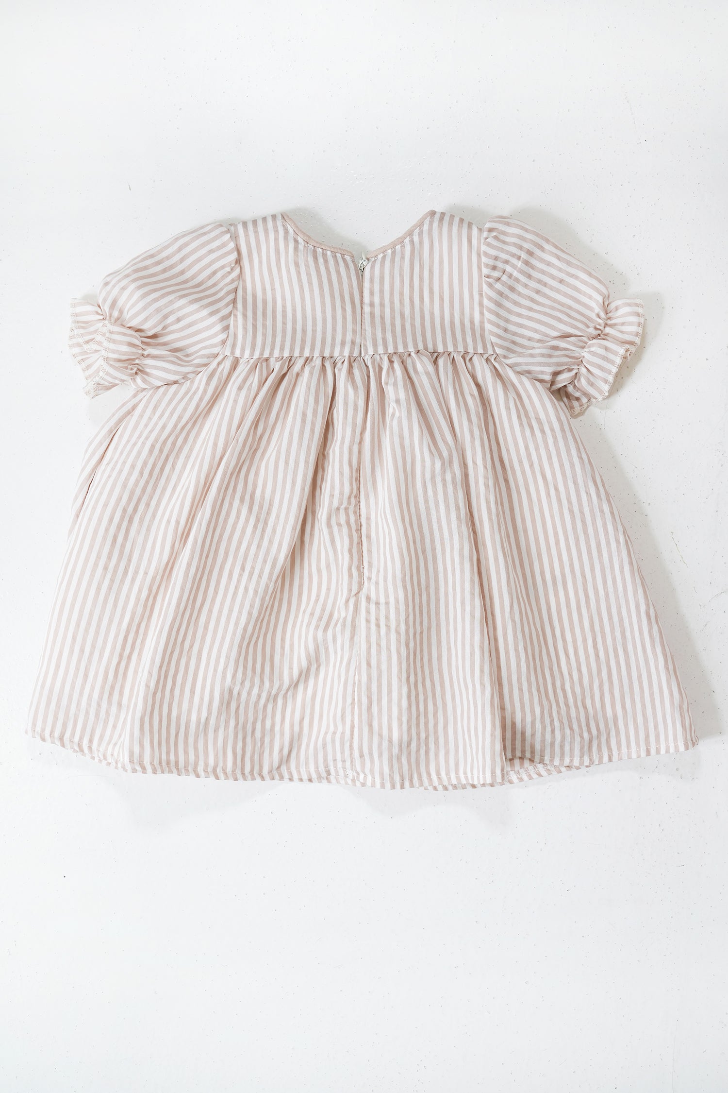 Beige Striped Emily Frock flat lay showing beige stripe fabric and shape