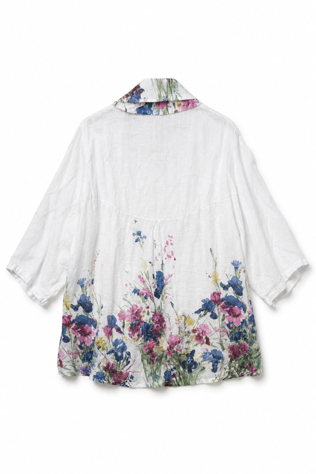 A white short-sleeve linen shirt with a vibrant watercolor floral print concentrated at the hem and on the inside of the collar, shown against a plain white background.