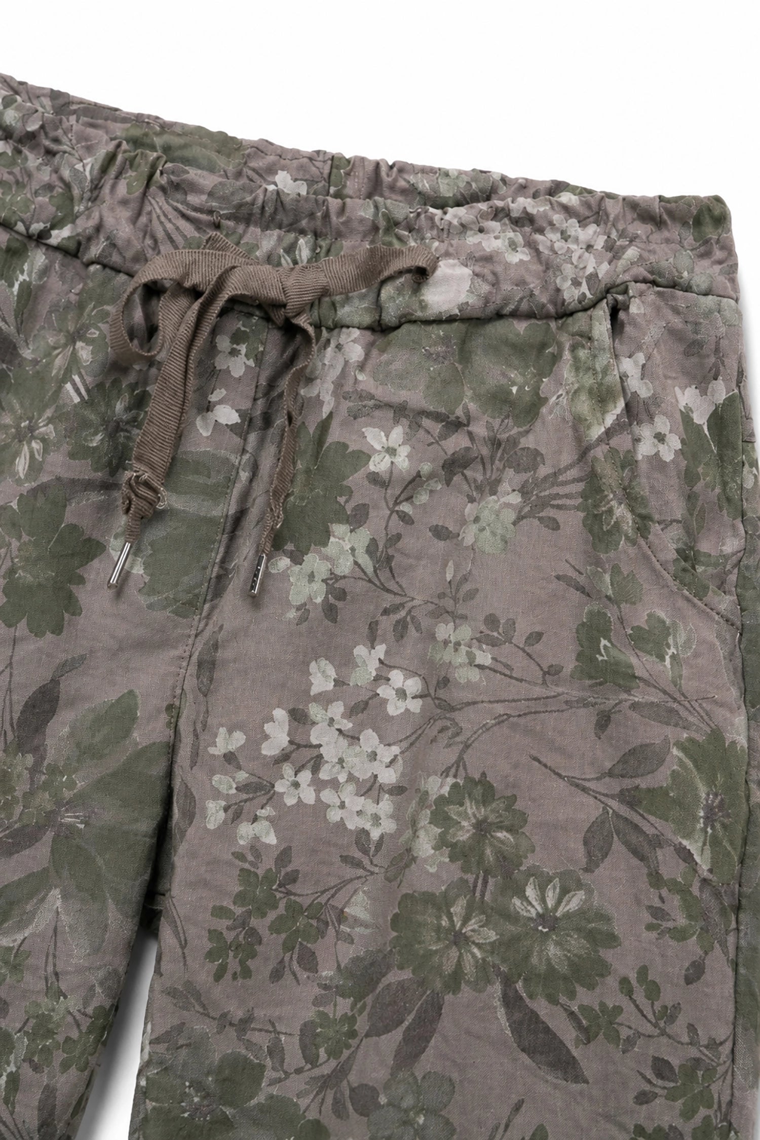 Floral-patterned pants with a drawstring on a white background