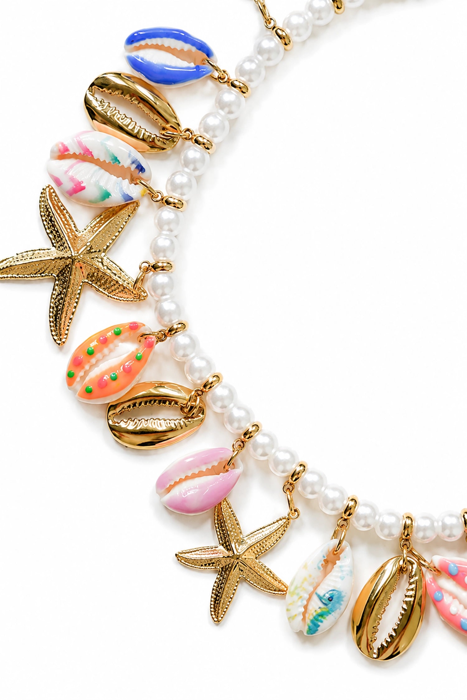 Necklace with shell and starfish charms on a white background