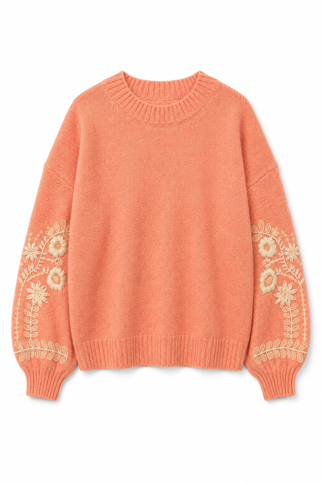 A peach-colored knit sweater with cream floral embroidery on the sleeves, displayed flat against a white background.