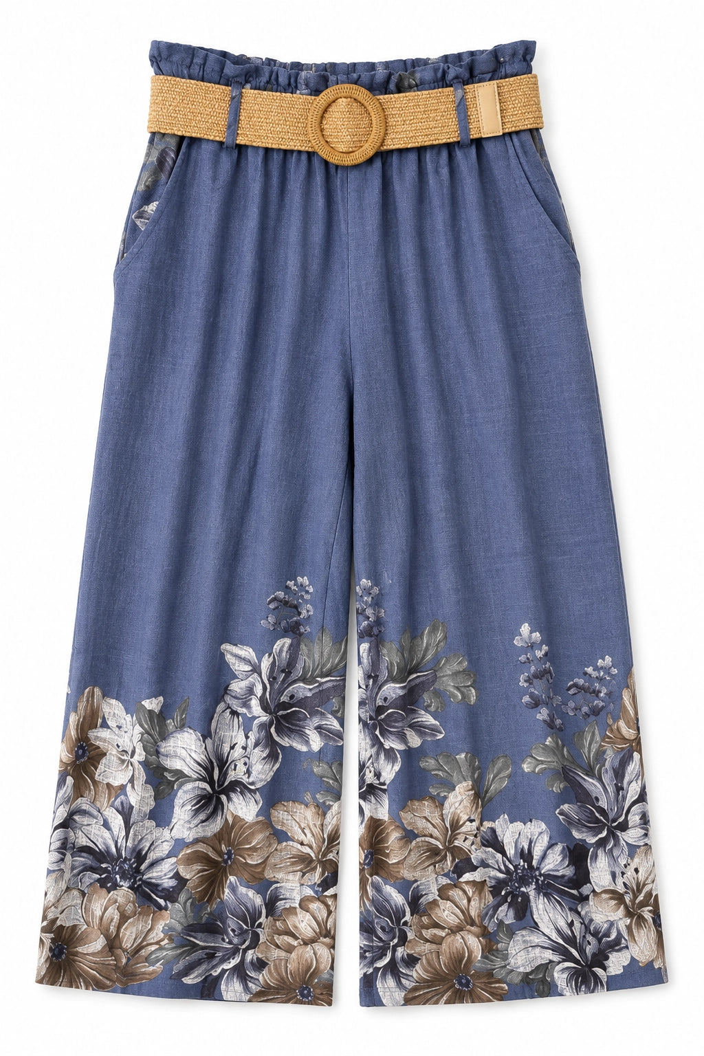 A pair of wide-leg cropped pants in a dusty blue fabric with a floral print along the hem, featuring a matching woven tan belt with a round wooden buckle.
