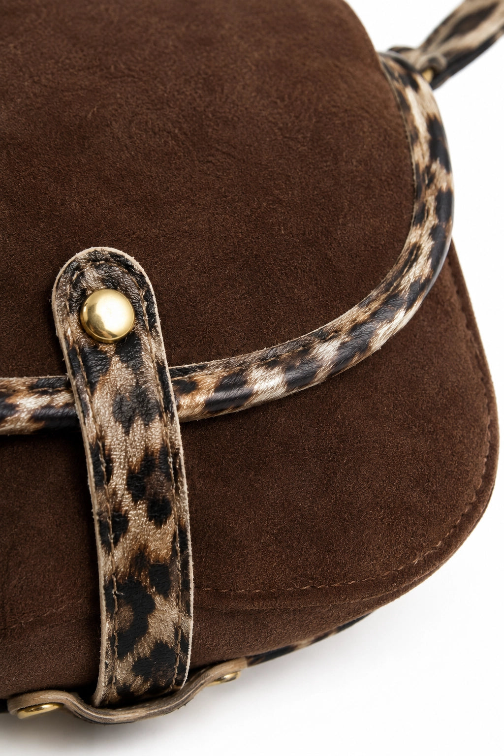 Close-up of a brown suede bag with a leopard-print strap and gold-tone snap closure on a white background.