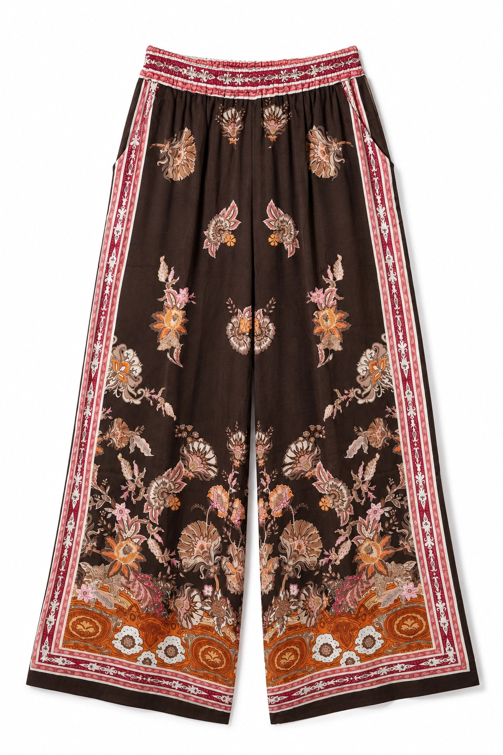A pair of wide-leg cropped pants in dark brown, featuring an all-over floral and butterfly print in muted pink, beige, and orange, with a red and white patterned border along the sides and hem.