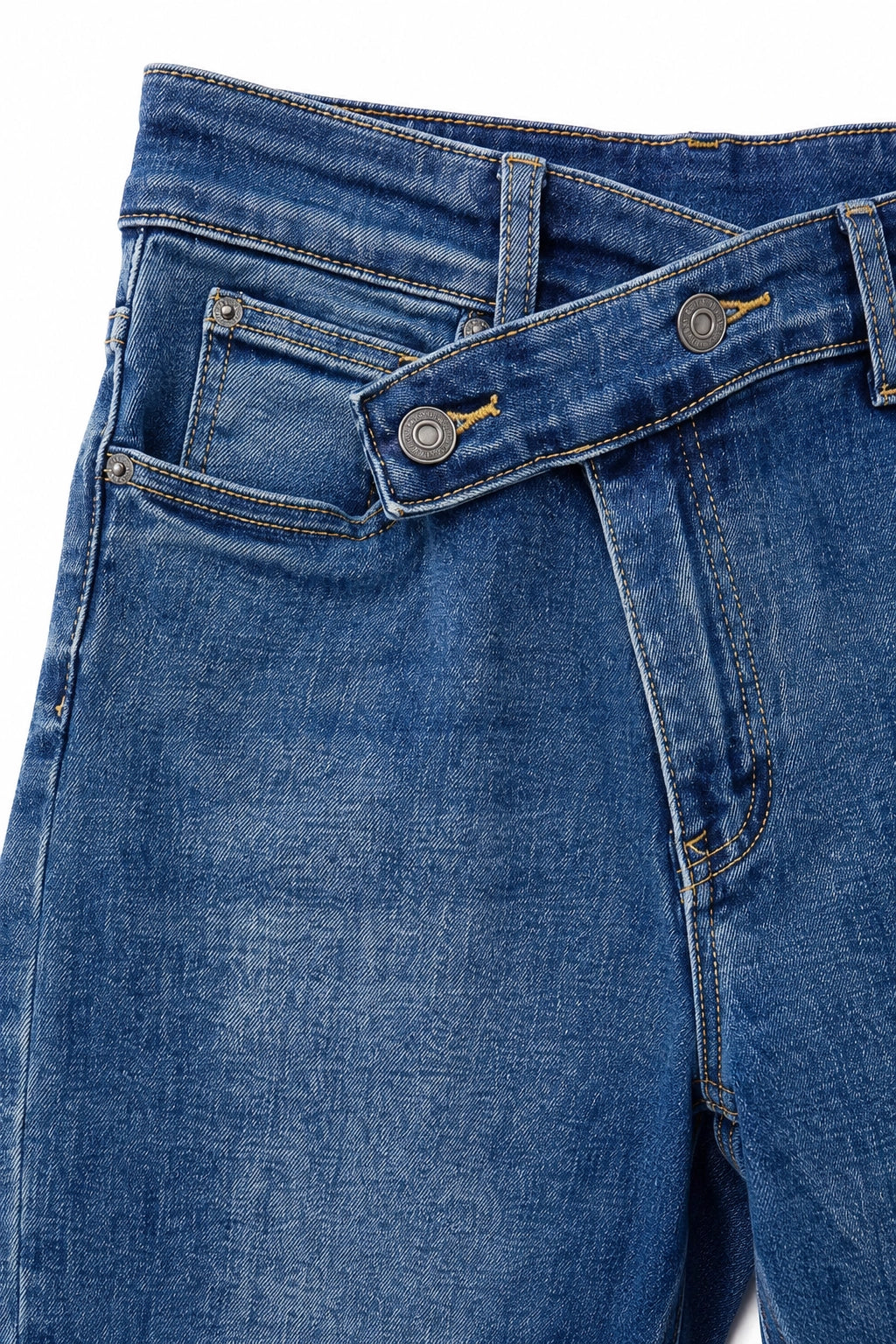 Close-up of a pair of blue denim jeans showing the front waistband, belt loops, button closure, and pocket details on a white background.