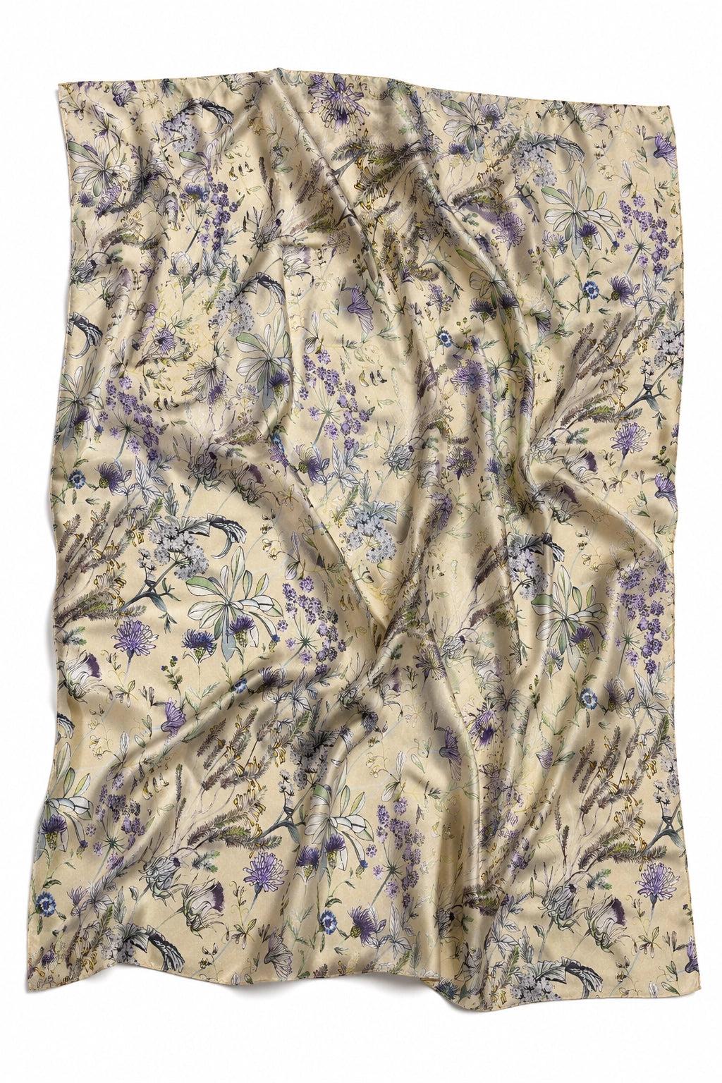A lightweight, semi-sheer scarf with a beige base and an all-over floral pattern in shades of purple, blue, and green, draped in soft folds against a white background.