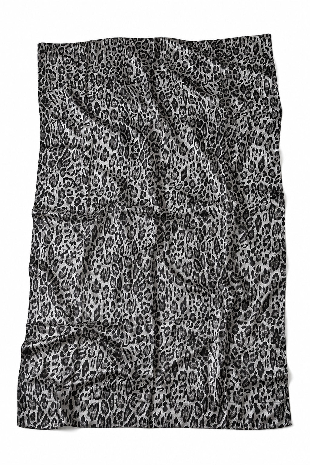 A rectangular textile item, likely a towel or blanket, featuring a black and white leopard print pattern, laid flat against a white background.