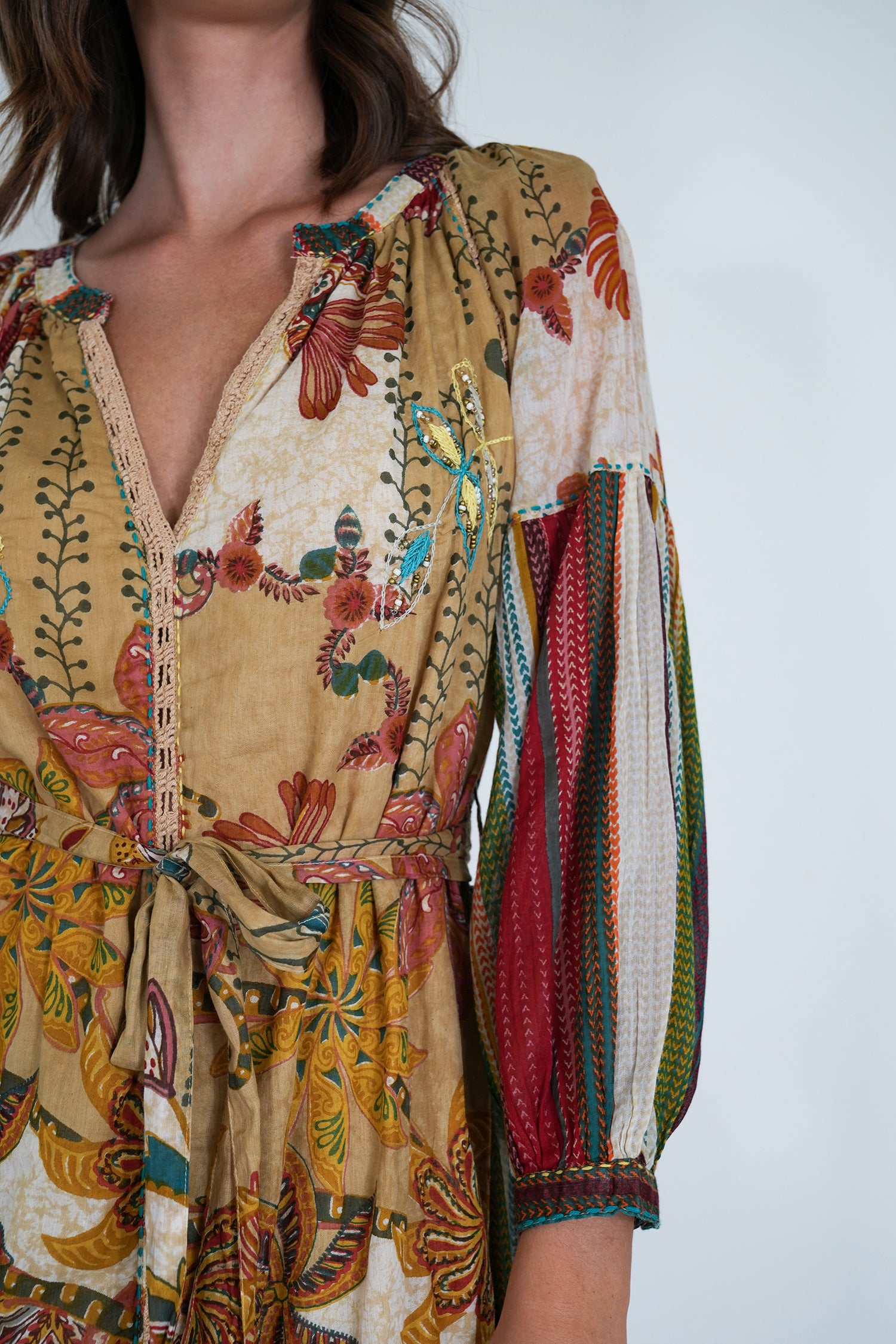 Colorful patterned dress with a plain background