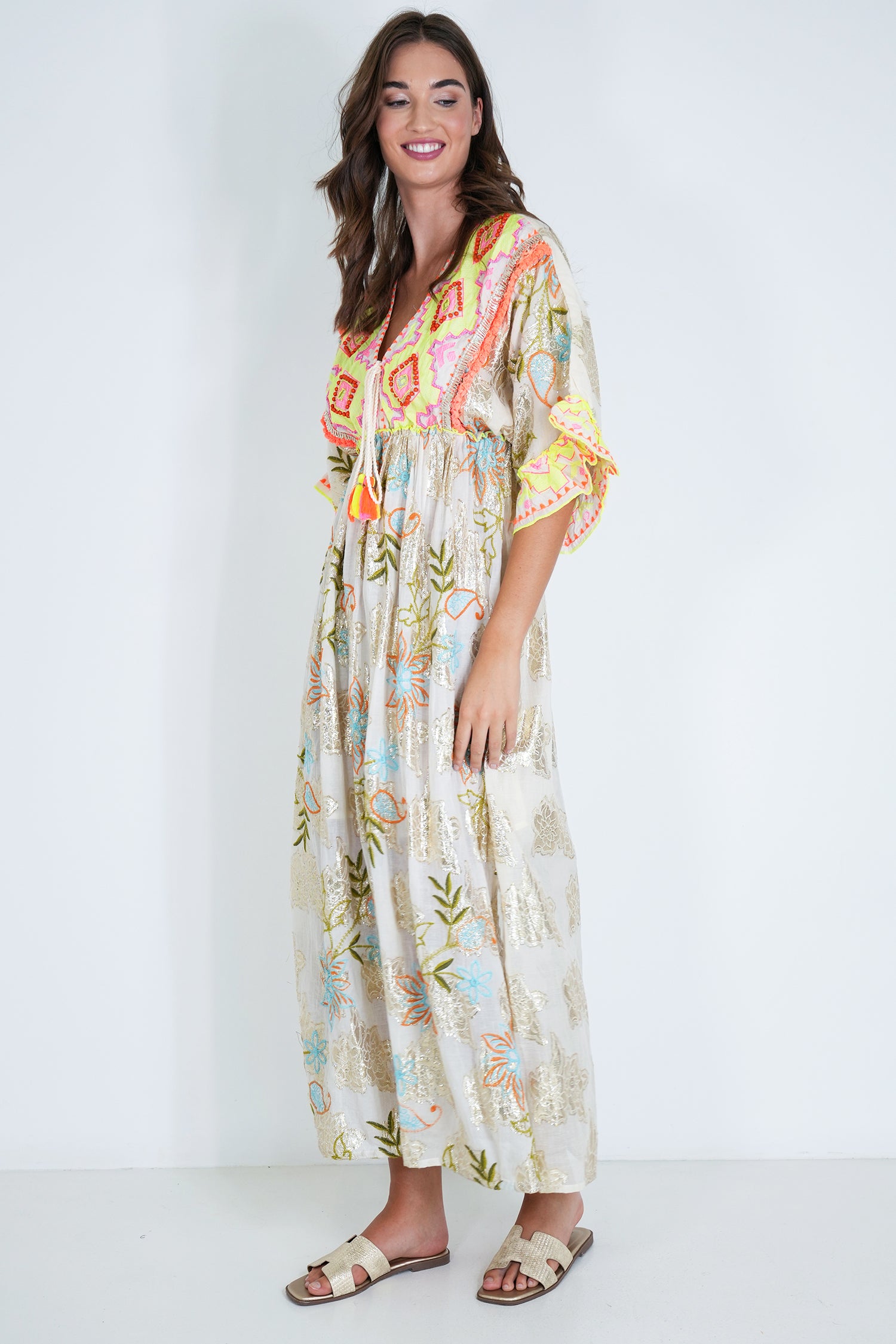Woman wearing a floral dress with a white background