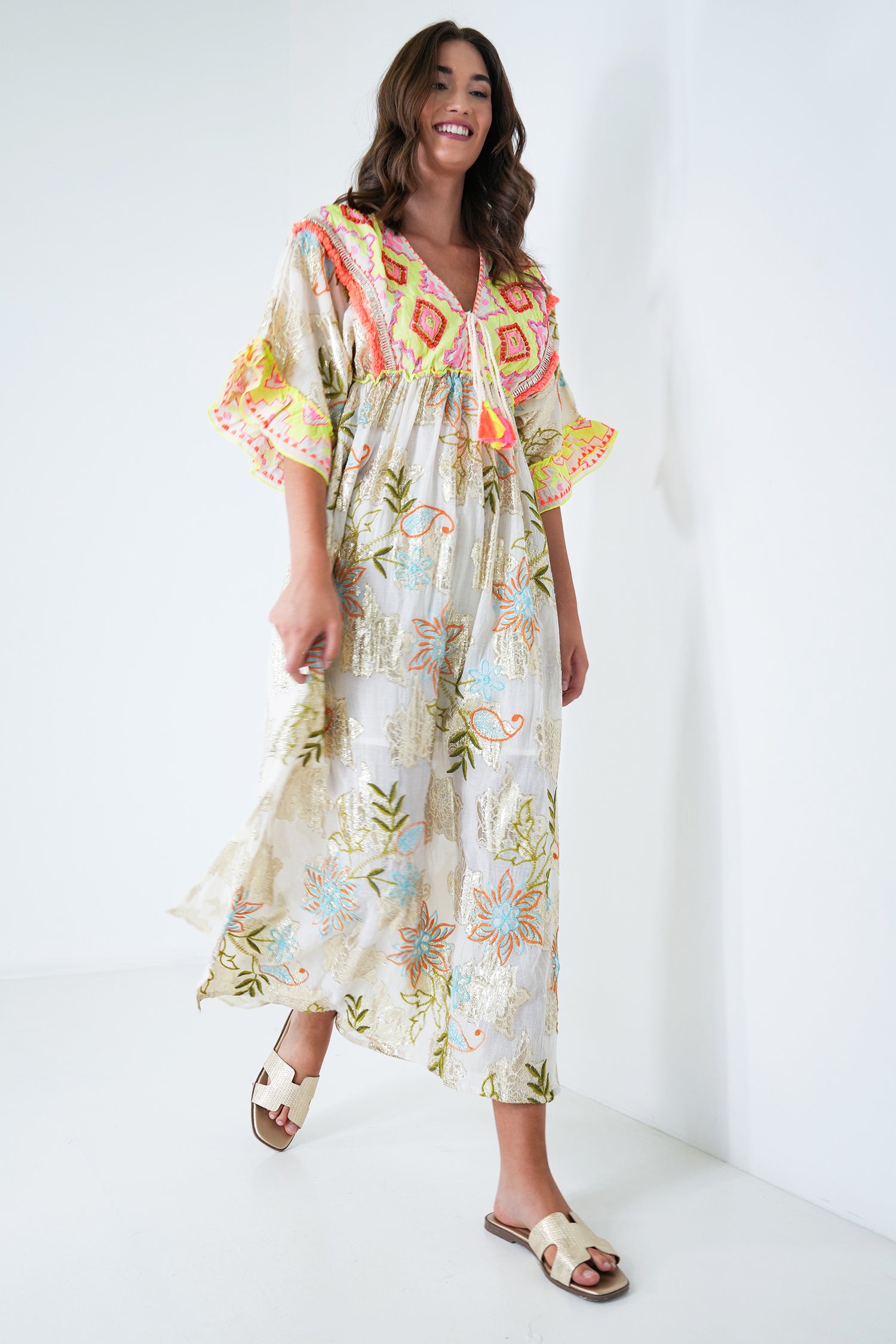 Woman wearing a floral dress with a white background