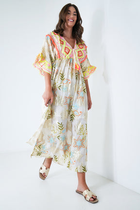 Woman wearing a floral dress with a white background