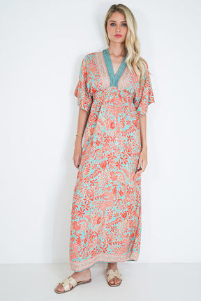 Woman wearing a floral dress on a white background