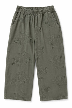 Olive green cropped pants with an all-over tonal floral jacquard pattern, featuring an elastic waistband and side pockets, shown flat on a white background.