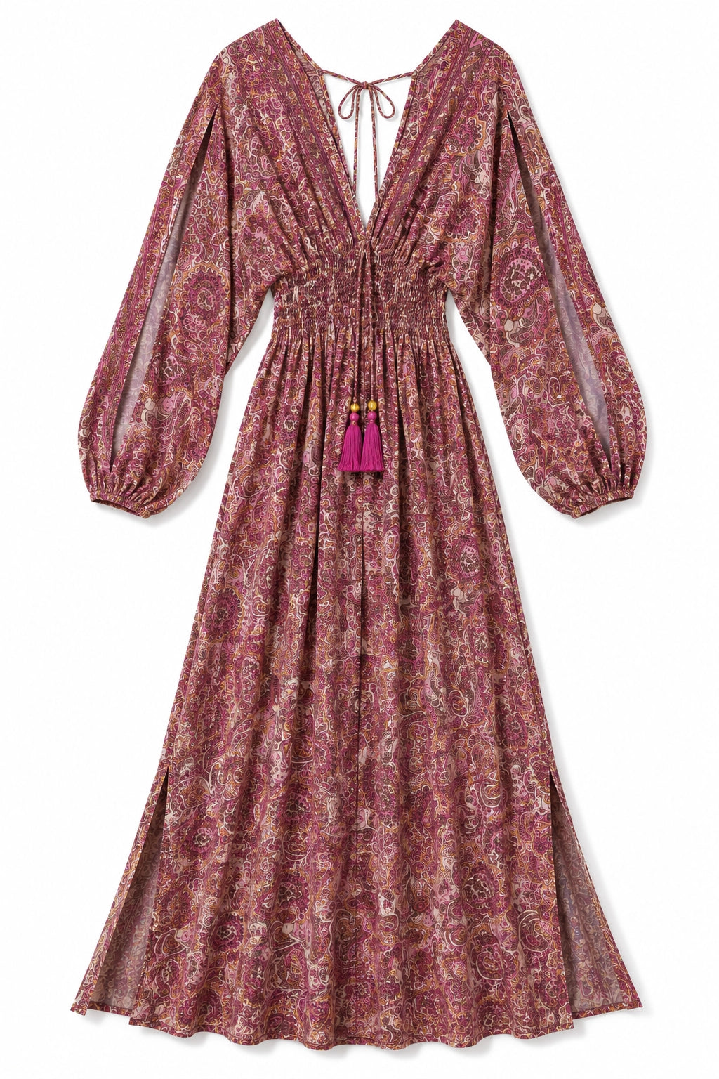 A long-sleeved midi dress with a dusty rose and beige paisley pattern, featuring a deep V-neckline with a tie, a smocked waist, and a bright magenta tassel accent.
