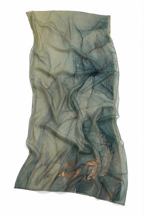 A lightweight sheer scarf with an abstract marbled pattern in muted teal, sage green, and slate gray, featuring subtle copper-brown veining, shown against a plain white background.
