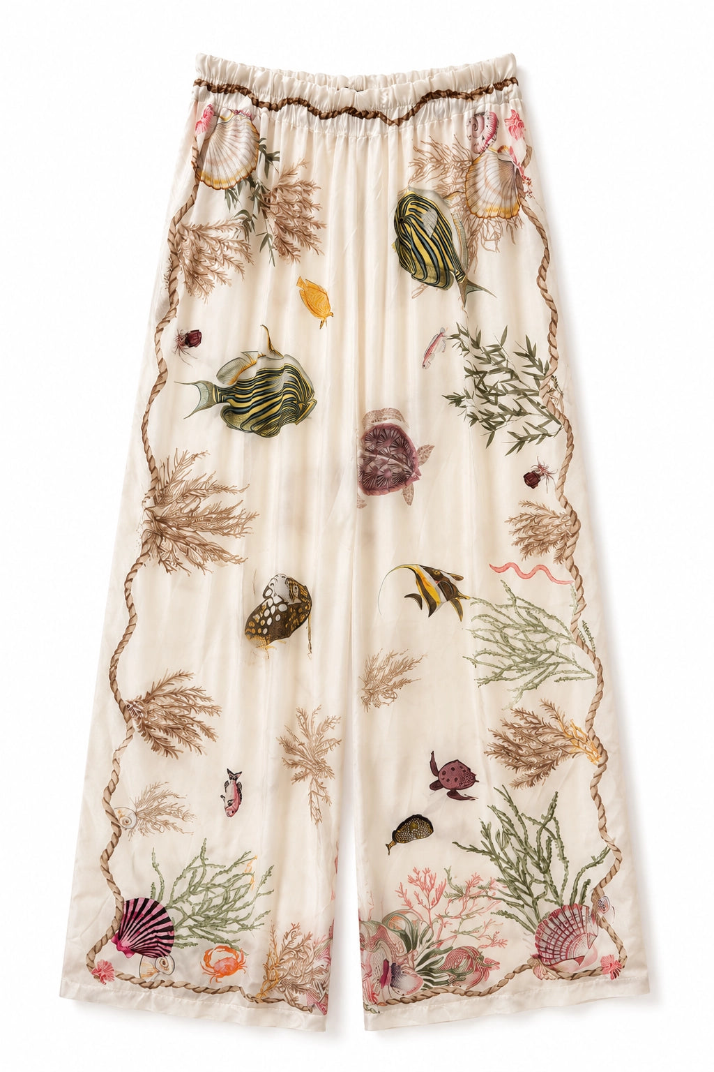 A pair of wide-leg cropped pants featuring an all-over ocean-themed print with fish, seashells, coral, and seaweed on a cream base, finished with a brown ruffled elastic waistband.