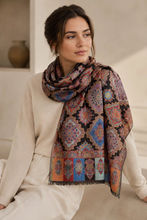 Woman wearing a patterned scarf in an indoor setting