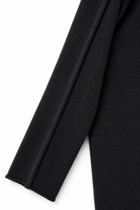 Close-up of a black fabric texture on a white background