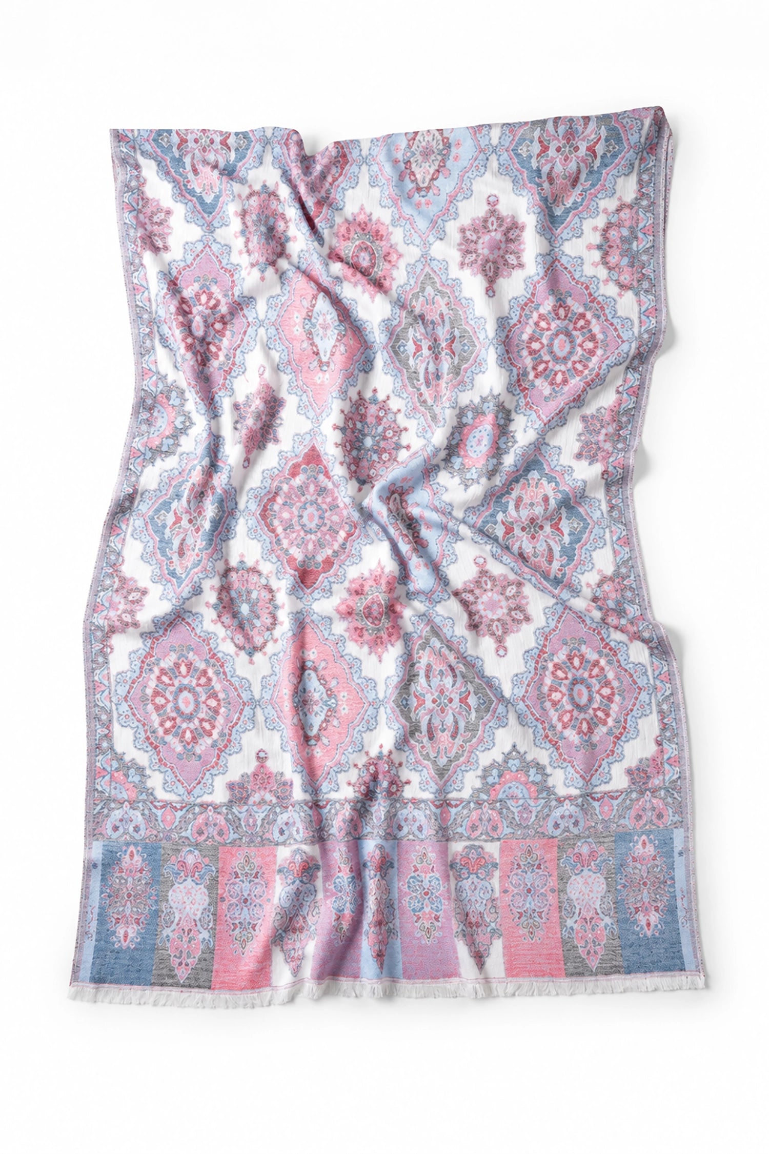 Patterned fabric with pink and blue design on a white background
