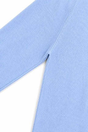 Close-up of a light blue fabric with a white background
