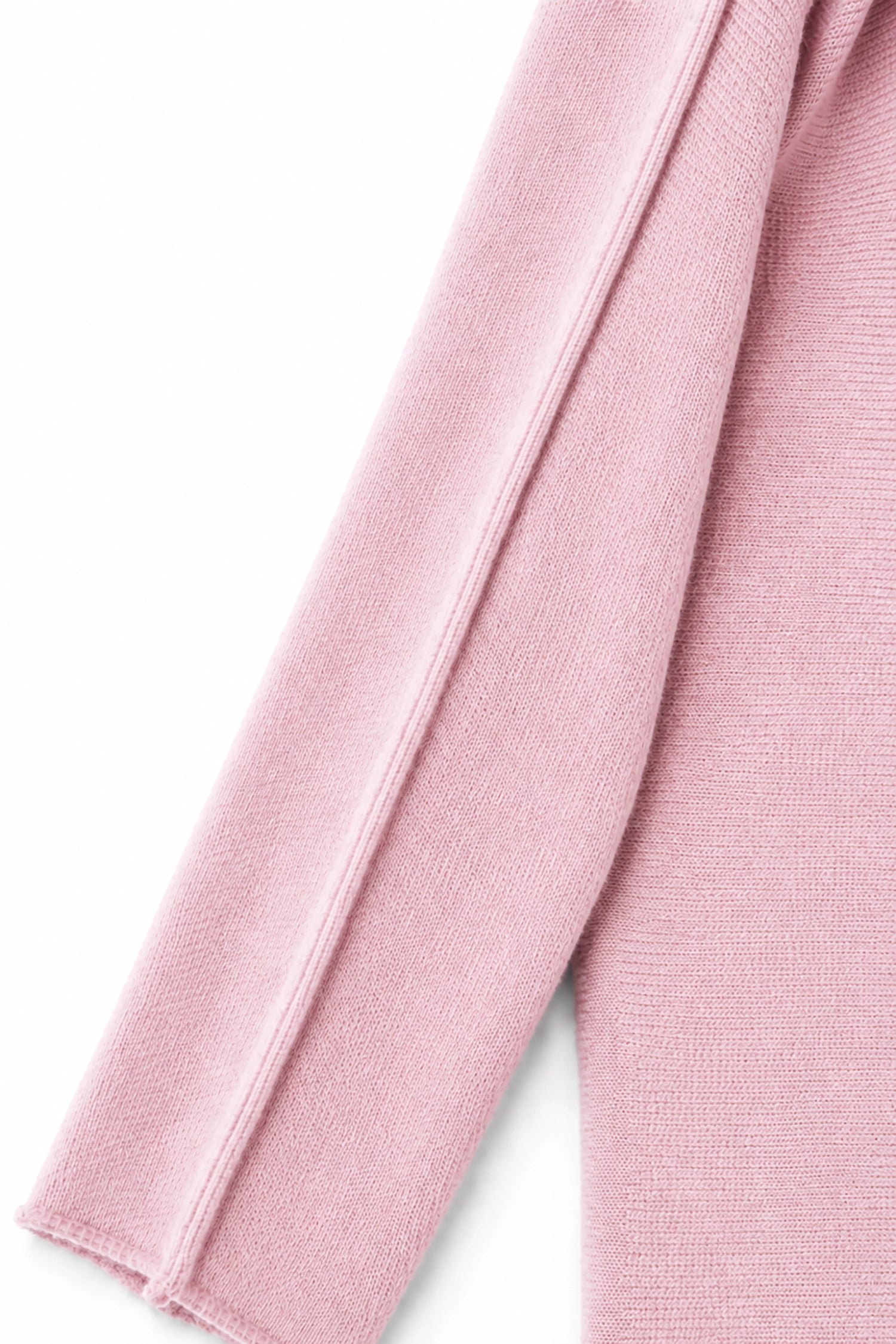 Close-up of pink fabric with a white background