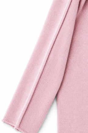 Close-up of pink fabric with a white background