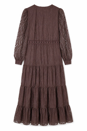 Brown tiered dress with long sleeves on a white background