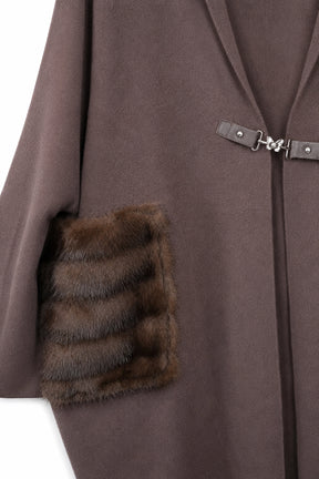 Brown coat with fur-trimmed pocket on a white background