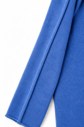 Close-up of blue fabric on a white background
