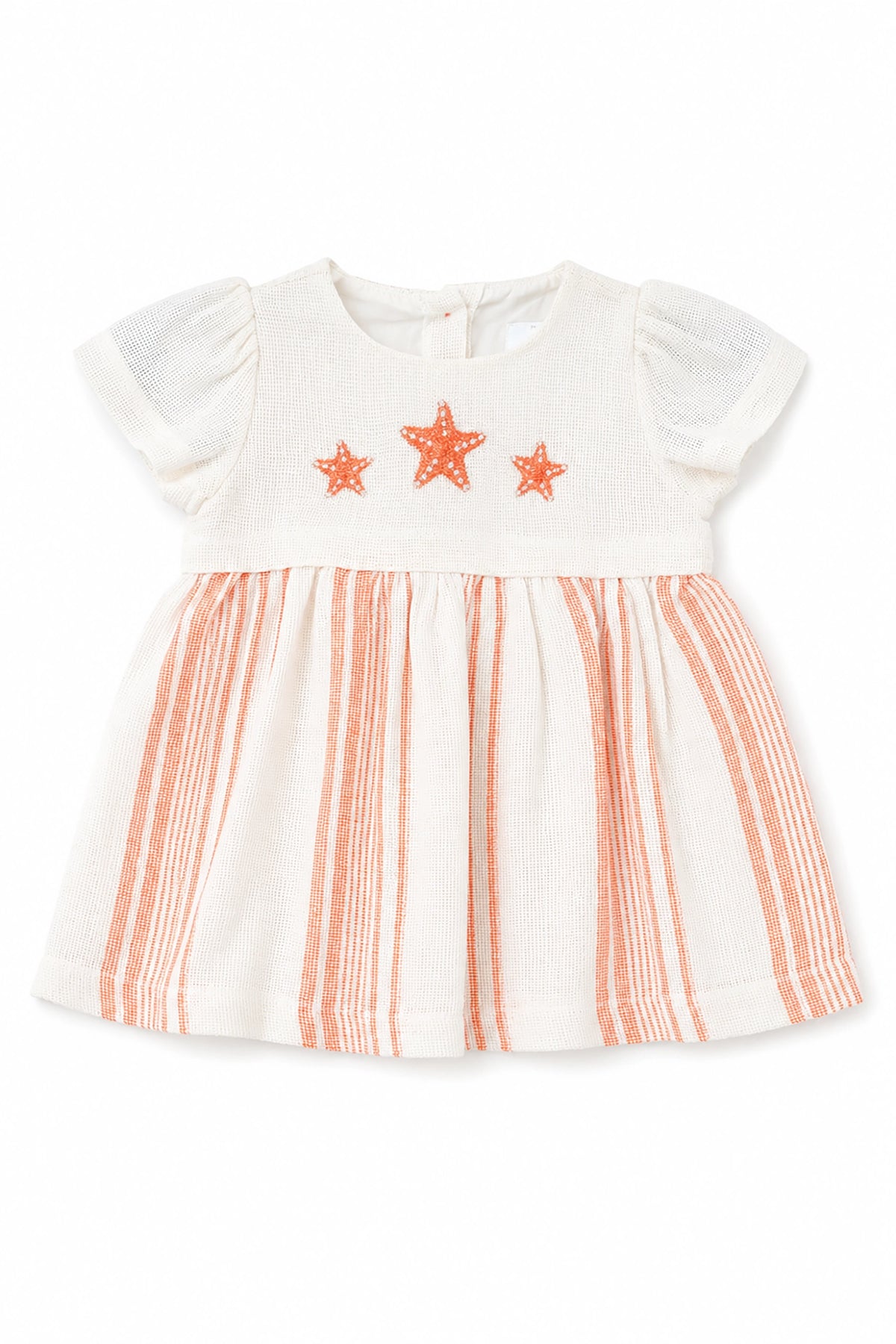 White dress with orange star patterns and striped skirt on a white background