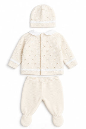 Cream-colored baby outfit with jacket, pants, and hat on a white background
