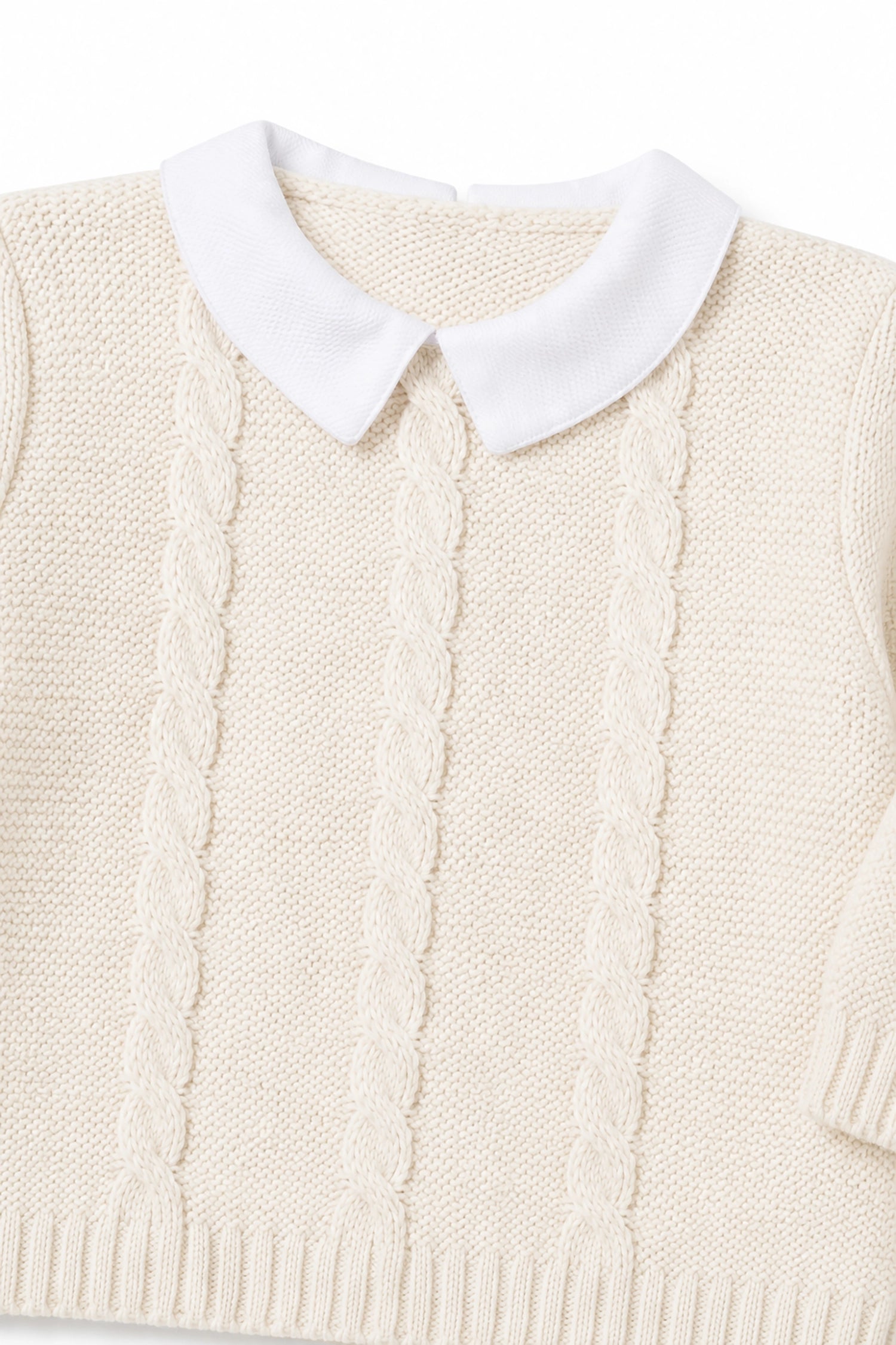 Cream-colored knitted vest with a white collar on a white background