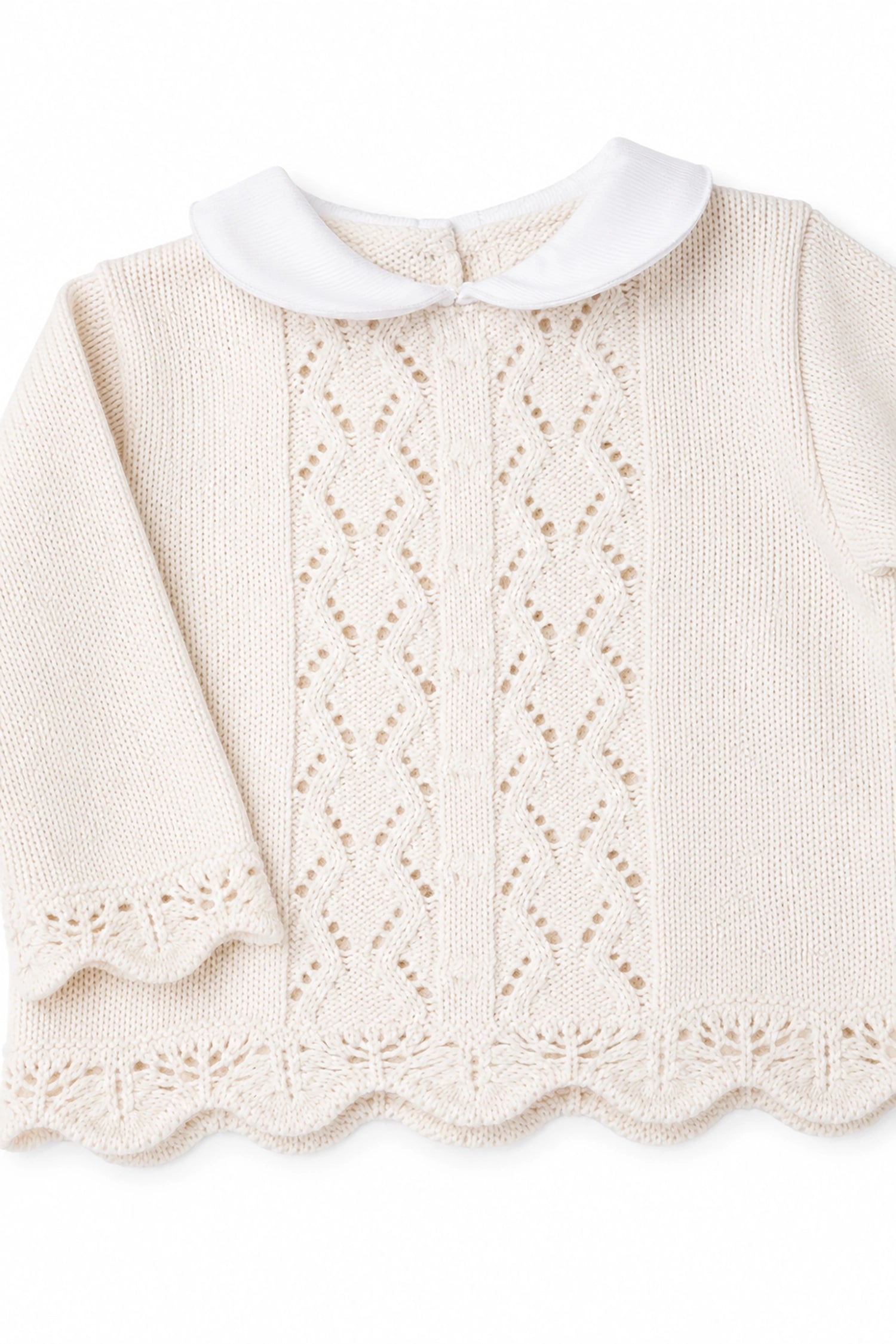 Knitted sweater with lace details on a white background