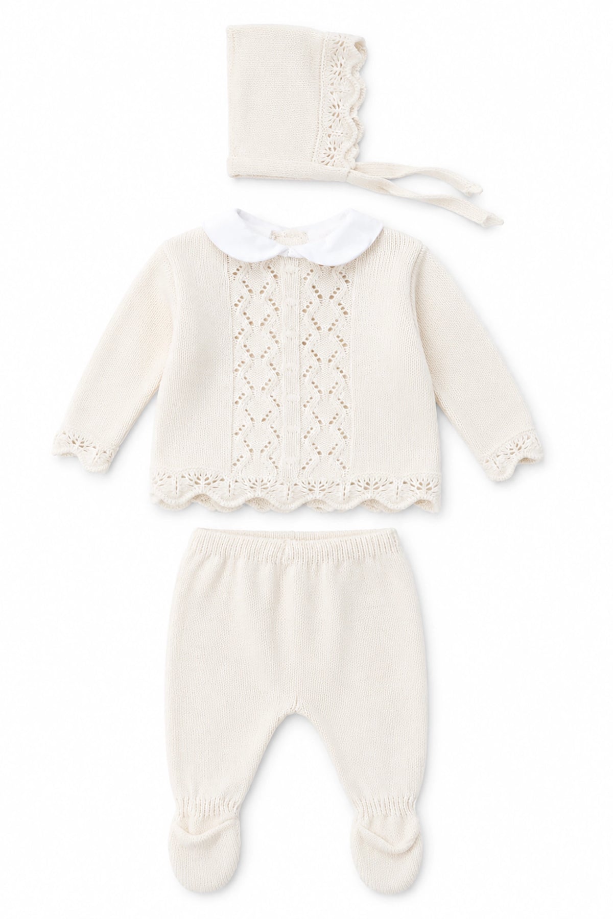 Baby outfit set with knitted top, pants, and bonnet on a white background