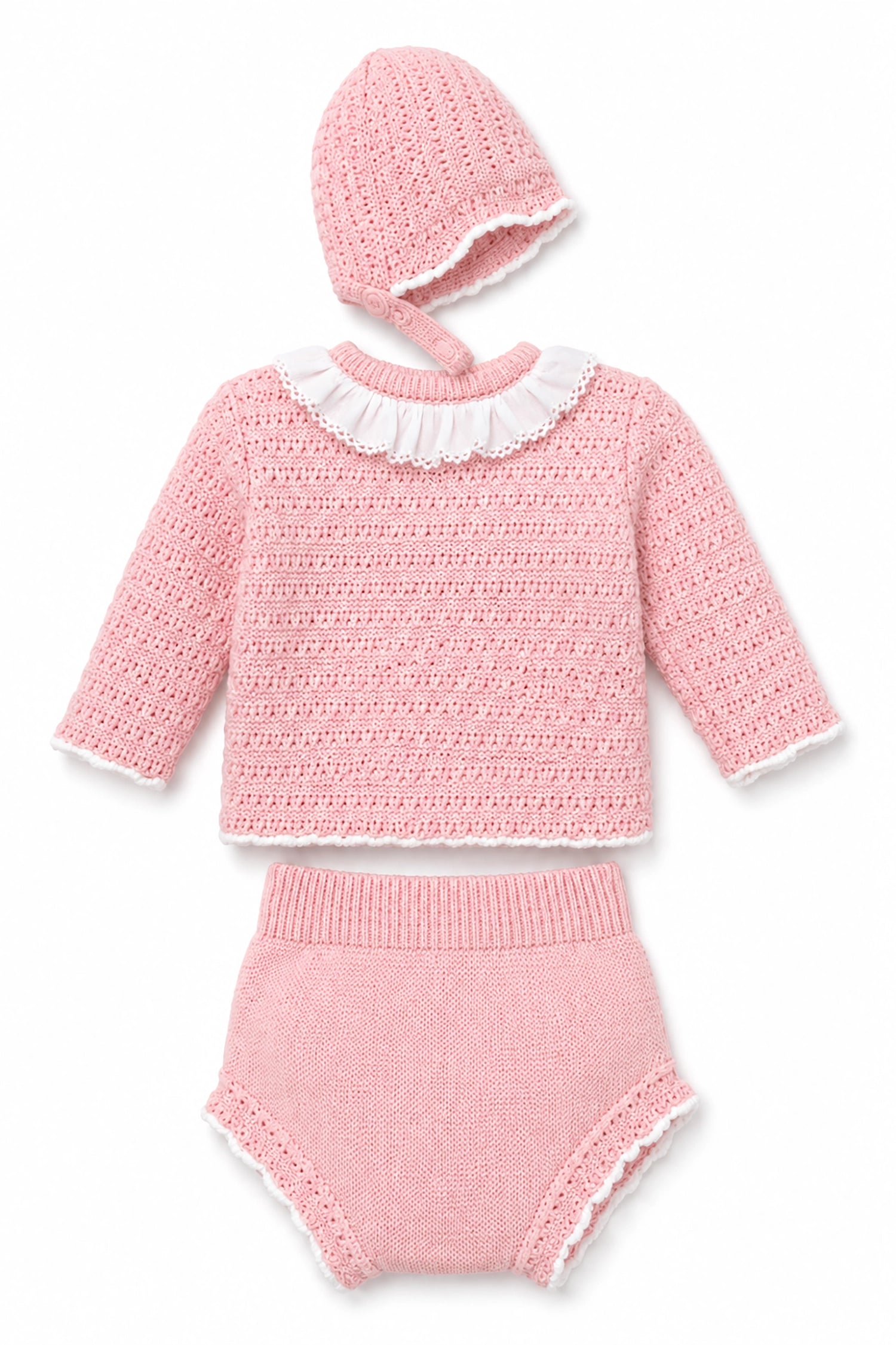 Pink knitted outfit with a hat on a white background