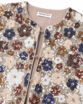 Sequined floral patterned garment with 'Something Pretty' label.