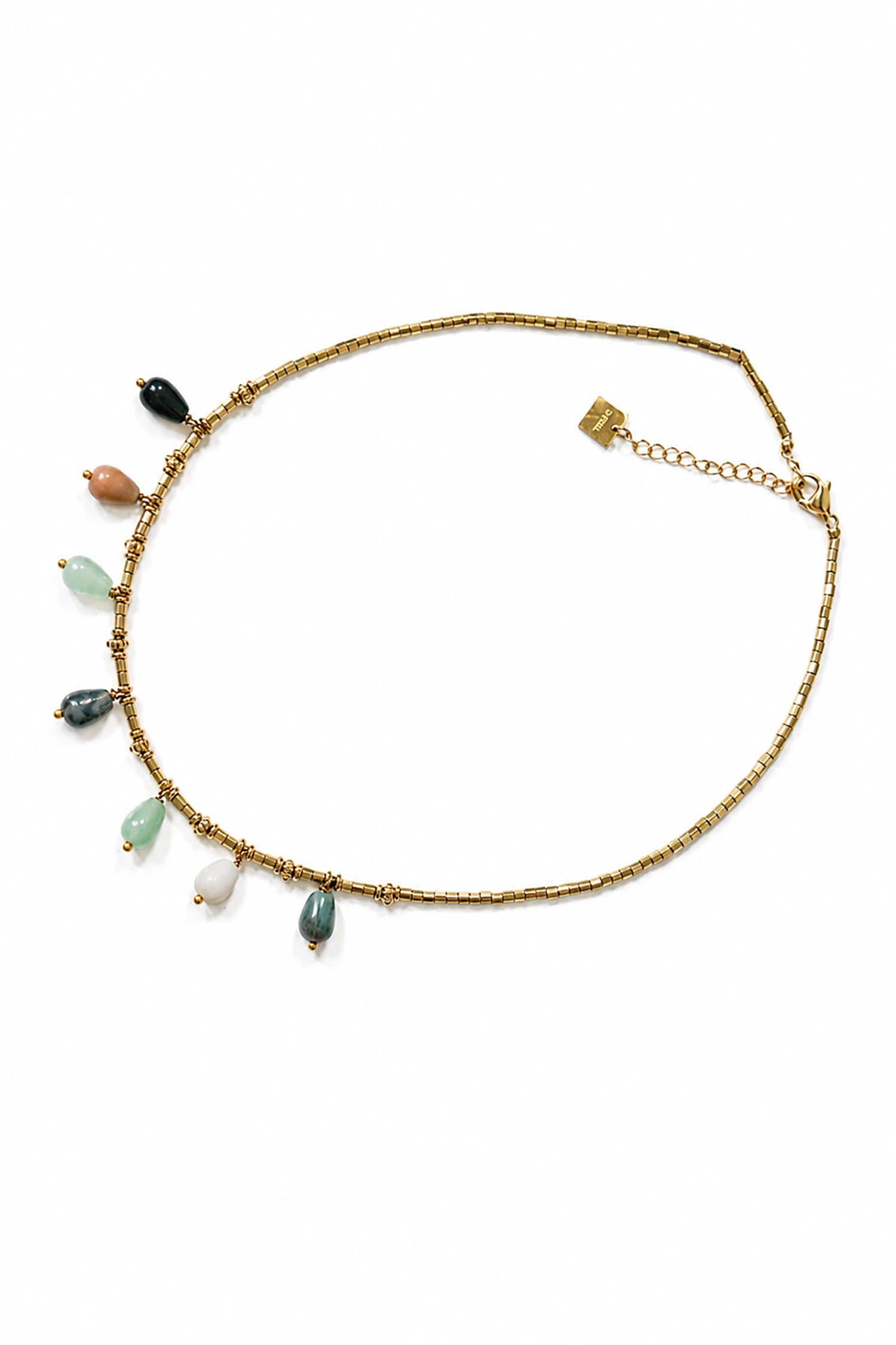 Gold necklace with colorful beads on a white background