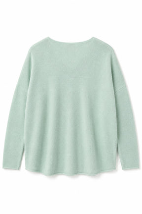 Light green sweater on a white background