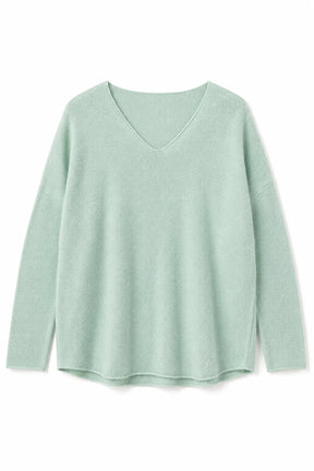 Light green sweater on a white background