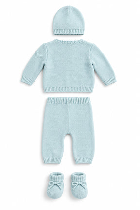 Knitted baby outfit with cardigan, pants, and booties on a white background