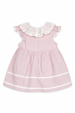 Pink dress with white lace collar on a white background
