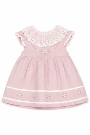 Pink dress with lace collar and floral embroidery on a white background