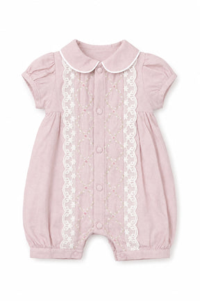 Pink baby romper with lace details on a white background