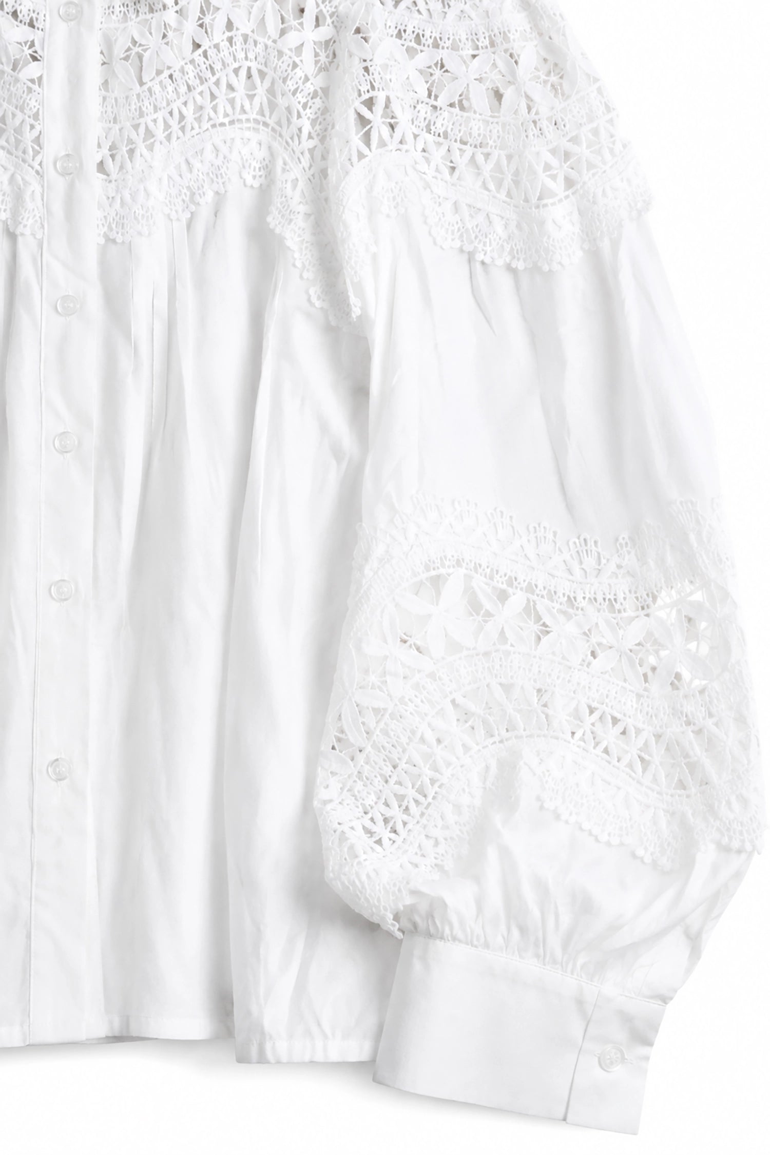 White lace top on a white background