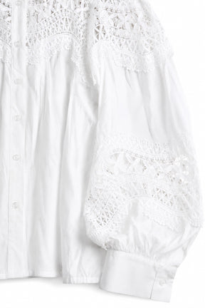 White lace top on a white background