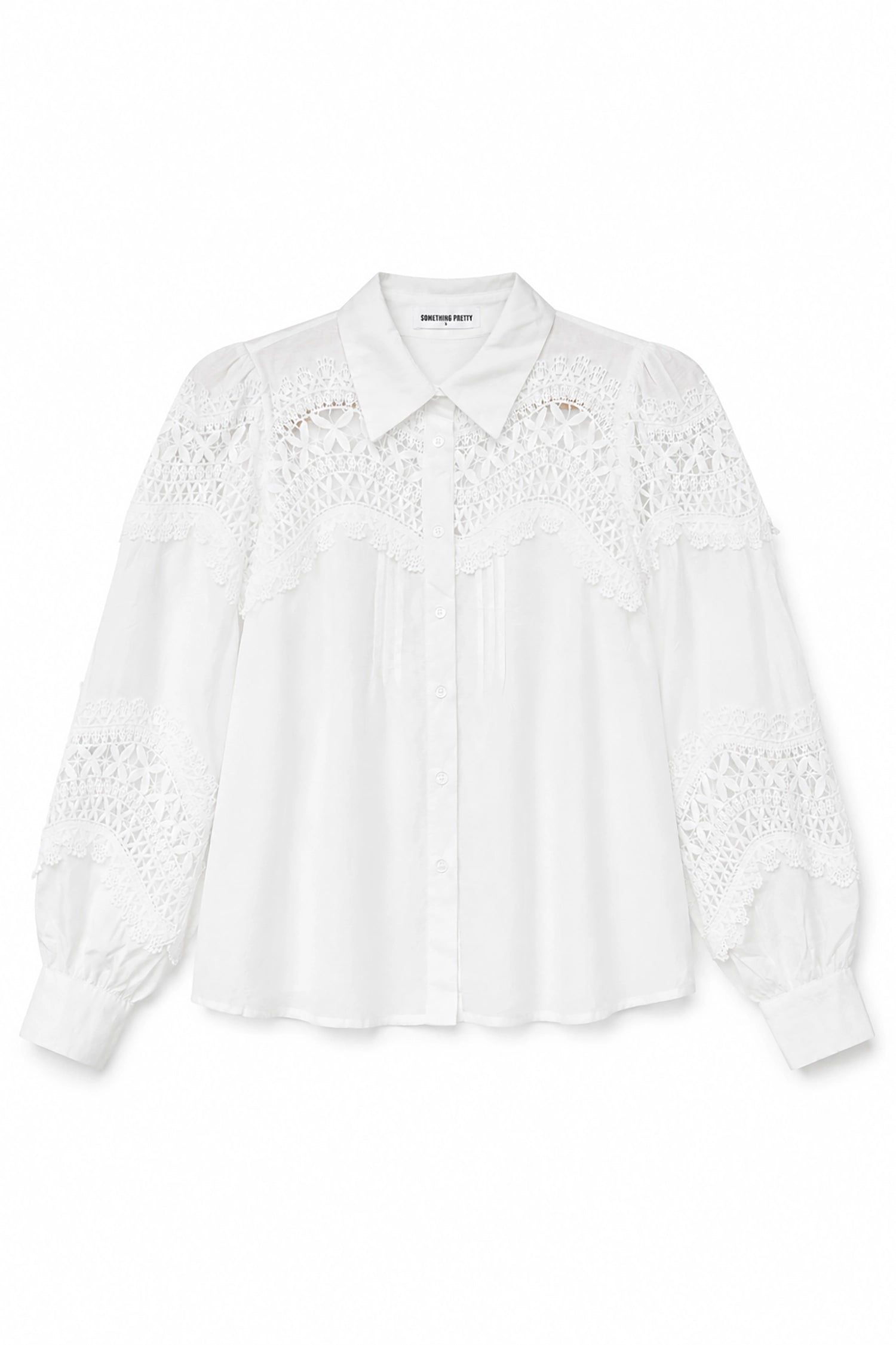 White blouse with lace details on a white background